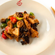 a fried eggplant dish with chopsticks